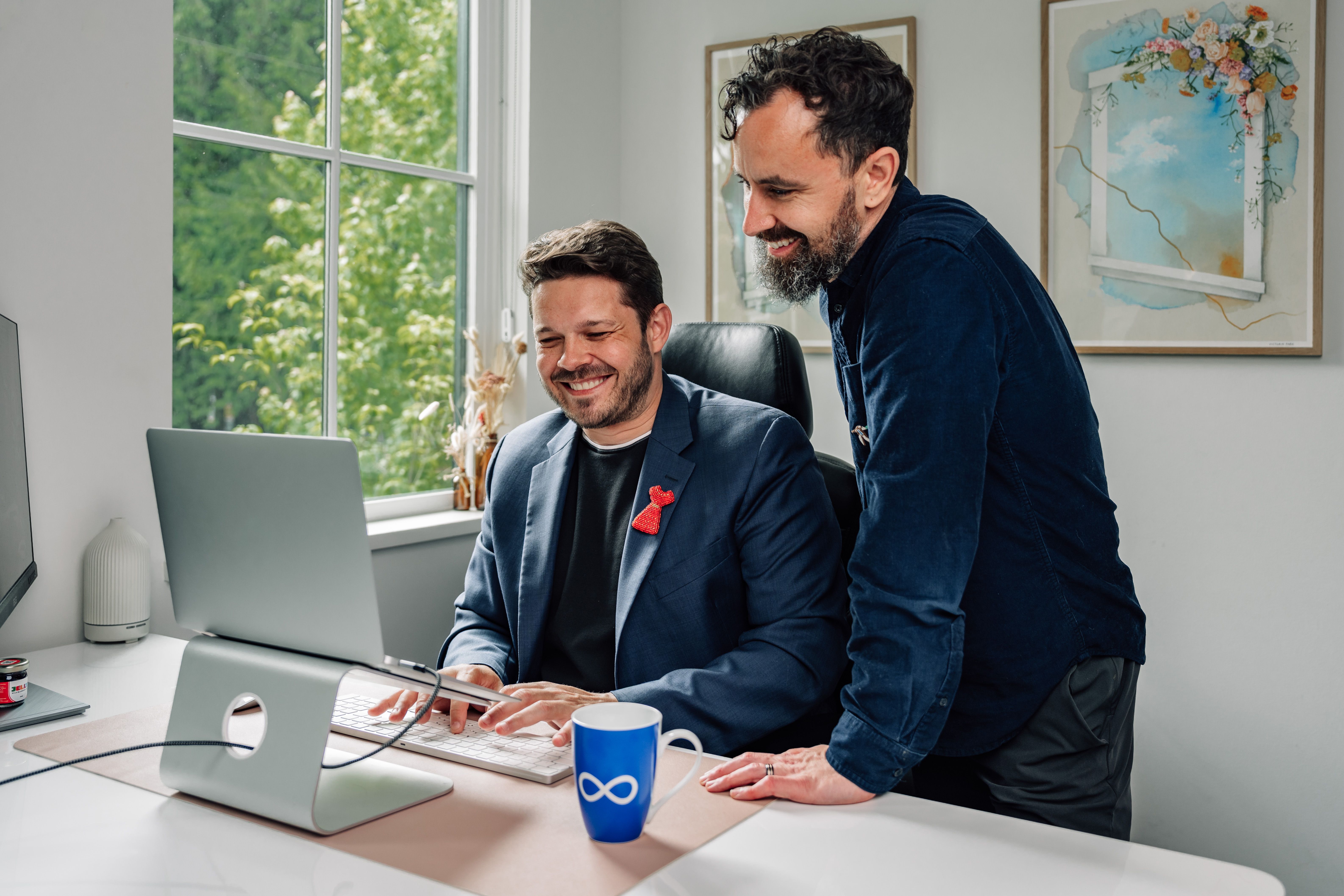 Two web professionals reviewing a website together
